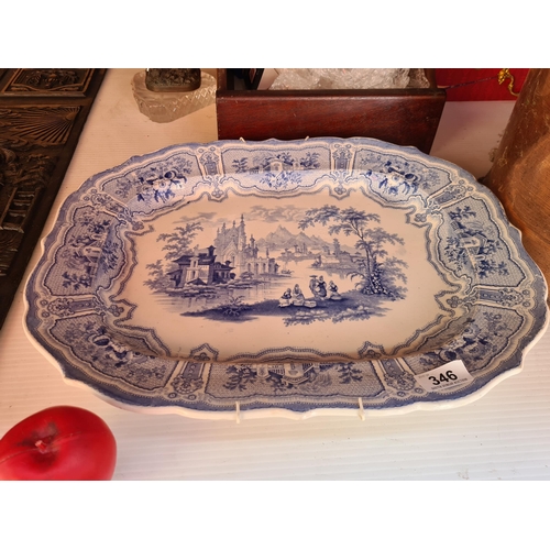 346 - A beautiful large 19th century blue and white  platter depicting architecture and nature scenes, in ... 