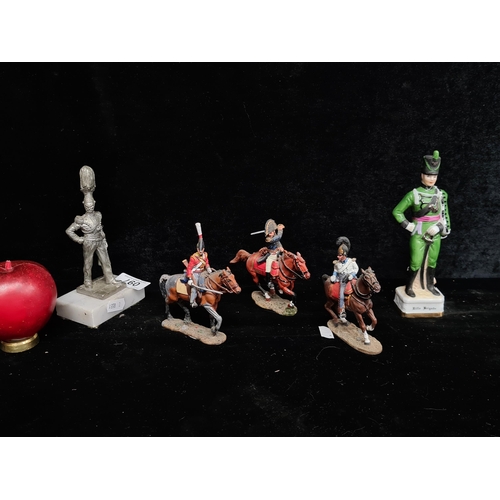 97 - A selection of military figurines including a Regal House Collection Rifle Brigade Officer, three of... 