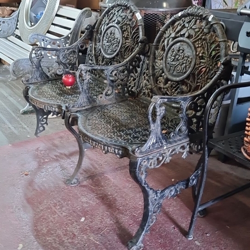 702 - Star lot : An Antique very fine Cast iron garden bench with intricate floral and cherub motif design... 