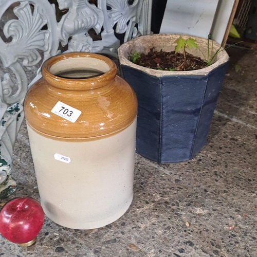 703 - Pair of ceramic plant pots, featuring one brown two-tone jar-style pot and one navy blue octagonal p... 