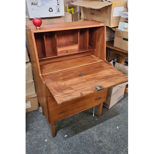 708 - Star lot : A super Mid-Century Modern teak writing desk with drop-front, internal compartments, and ... 