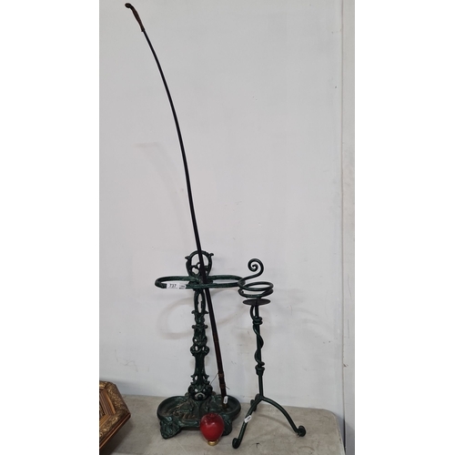 737 - Vintage cast iron umbrella stand with attached walking stick holder and cane rest, featuring intrica... 