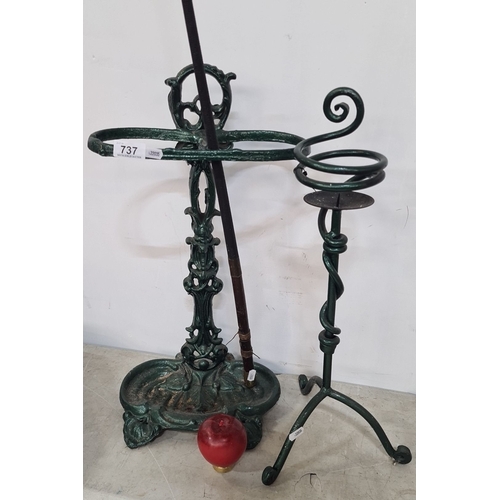 737 - Vintage cast iron umbrella stand with attached walking stick holder and cane rest, featuring intrica... 