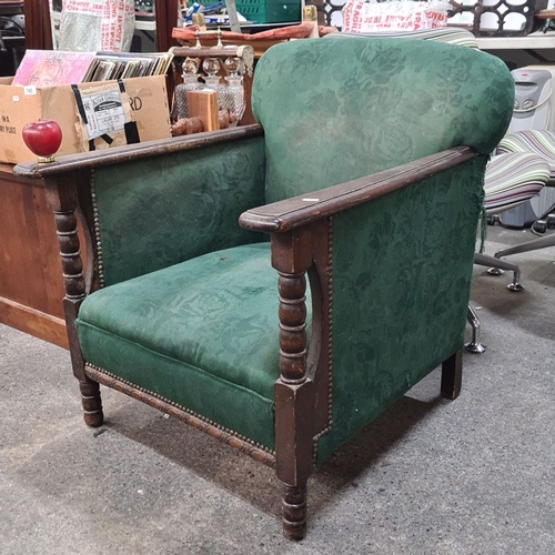 740 - Vintage wooden armchair with green floral upholstery. Features turned arm supports and a sturdy fram... 