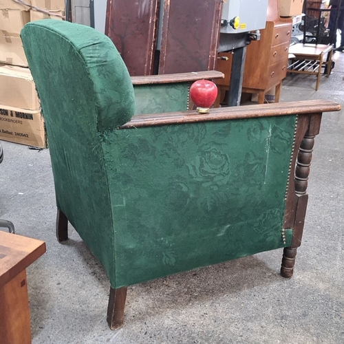 740 - Vintage wooden armchair with green floral upholstery. Features turned arm supports and a sturdy fram... 