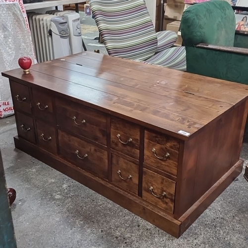 746 - Star Lot : Solid  wooden, next Interiors coffee table with storage compartments. It features a hinge... 