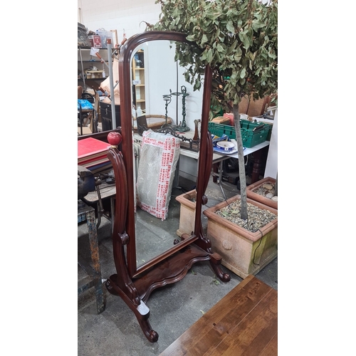 750 - Star Lot: A beautiful Victorian-style mahogany cheval mirror with elegant carved details and a tilti... 