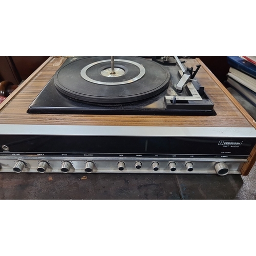 752 - A vintage Ferguson Unit Audio record player. Has a wood veneer finish and integrated controls. Inclu... 