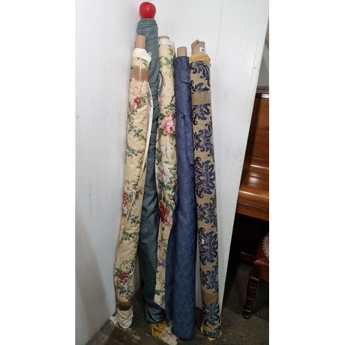 800 - Five rolls of assorted fabric, featuring floral, damask, and solid blue patterns. Various lengths an... 