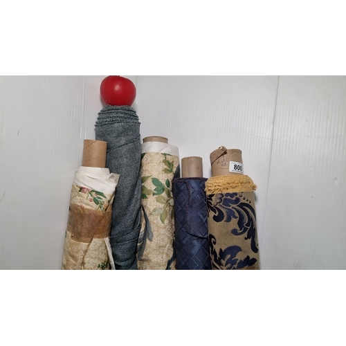 800 - Five rolls of assorted fabric, featuring floral, damask, and solid blue patterns. Various lengths an... 