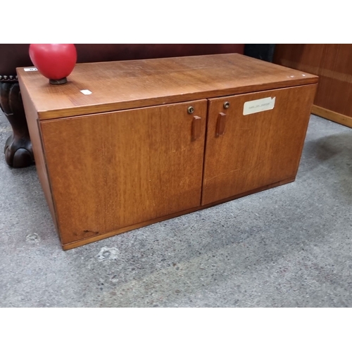 812 - A Mid-century modern Collectors cabinet, oak storage cabinet with double doors, featuring internal d... 