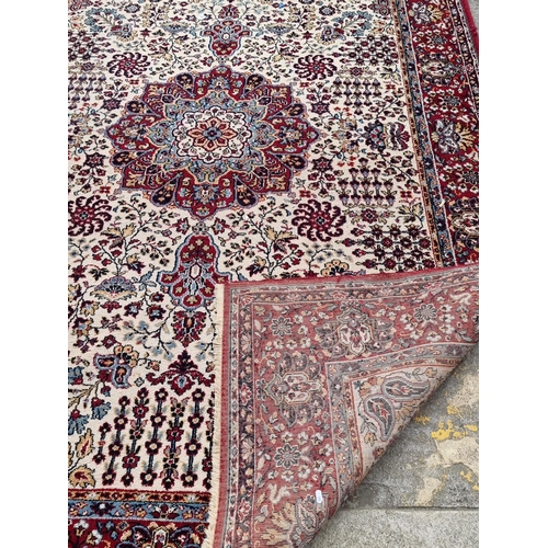 817 - Star lot : Persian-style hand-knotted rug, intricate floral pattern with rich red, blue, and ivory t... 