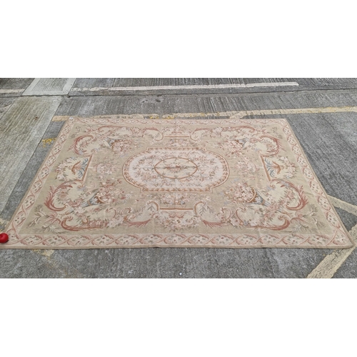 818 - Star lot : Large handwoven Laura Ashley wool rug featuring intricate floral designs in soft pastel t... 