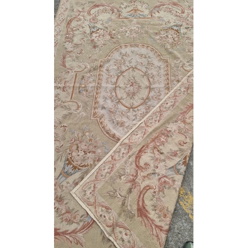 818 - Star lot : Large handwoven Laura Ashley wool rug featuring intricate floral designs in soft pastel t... 