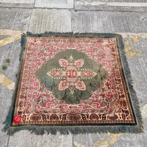 820 - Star lot : Vintage Persian-style rug featuring intricate floral patterns in rich red, green, and ivo... 