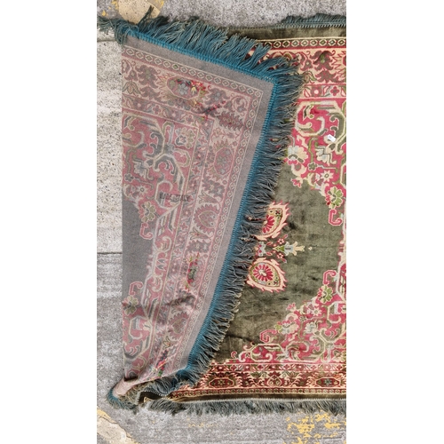 820 - Star lot : Vintage Persian-style rug featuring intricate floral patterns in rich red, green, and ivo... 