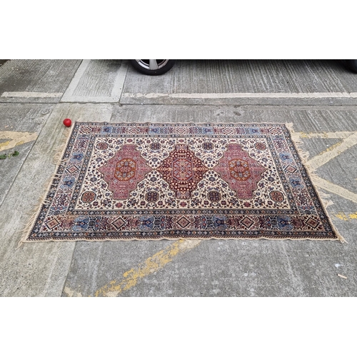 821 - Star lot : Hand-knotted Persian-style rug with intricate geometric and floral patterns in red, blue,... 