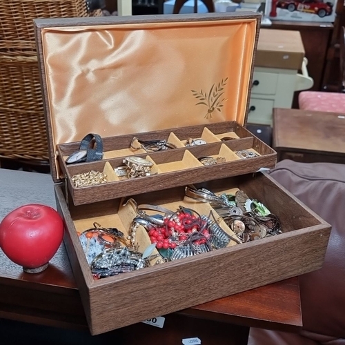 827 - Wooden jewelry box containing a mixed collection of jewelry and watches. Various materials and desig... 