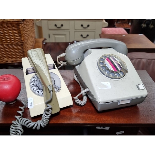 829 - Pair of vintage very cool rotary telephones, one beige and one grey, with classic dial designs. Made... 