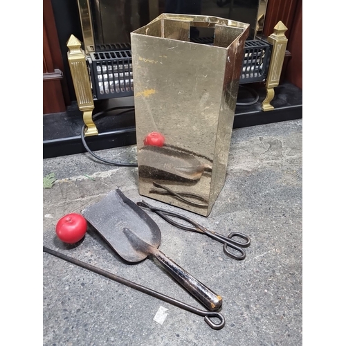 831 - Brass fireplace tool set with shovel, tongs, poker, and matching holder.