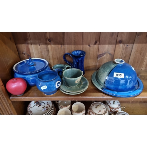 835 - Collection of handcrafted ceramic pottery. Includes lidded dishes, mugs, cups, and saucers. Features... 