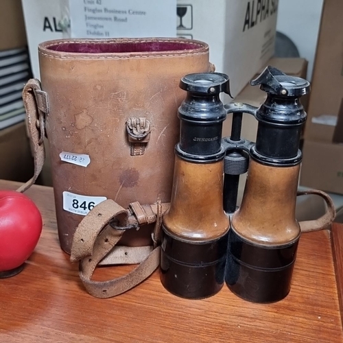 846 - Binoculars by J.W. Nugent in leather case, marked 