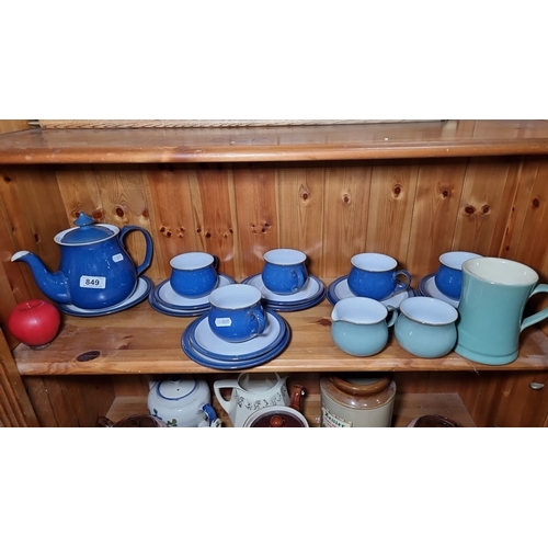 849 - Blue ceramic Denby tea set including a teapot, cups, saucers, and milk jug, marked 'Denby' on the bo... 