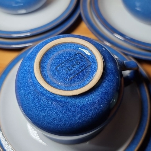 849 - Blue ceramic Denby tea set including a teapot, cups, saucers, and milk jug, marked 'Denby' on the bo... 