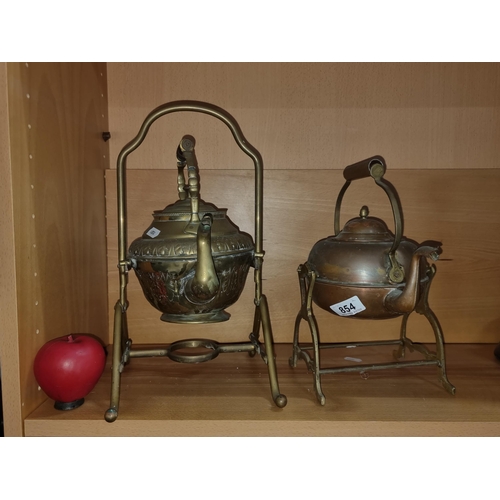 854 - Two antique brass and copper kettles including an embossed 19th century brass spirit kettle example.