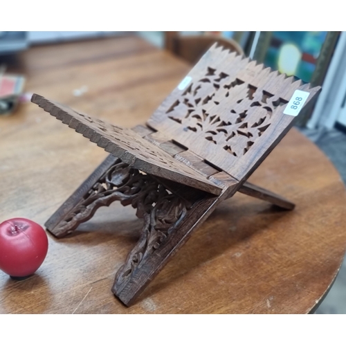 868 - A very pretty antique hand carved foldable book stand. Lovely foliate detailing.