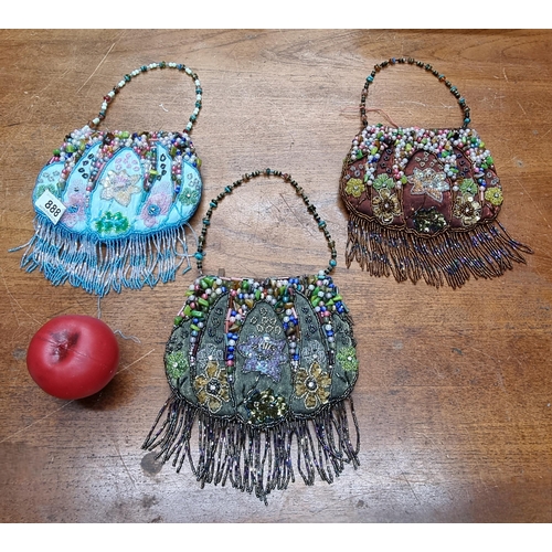 888 - Three stunning vintage beaded evening bags with fringe details.