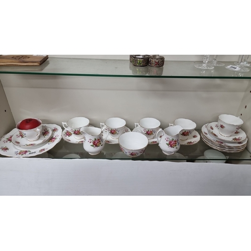 900 - Melba Bone China tea set, floral pattern, made in England. Includes cups, saucers, plates, milk jug,... 