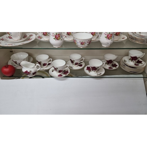 901 - Bone China tea set from Royal Stuart. The set features floral motifs and gilt accents. It includes c... 