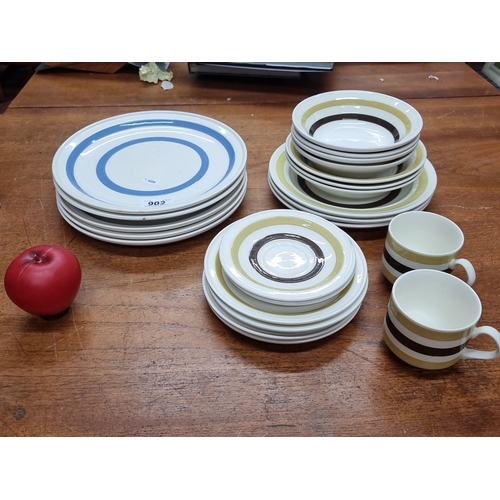 902 - Set of Carrigaline Pottery dishware, County Cork, Ireland. Includes ten dinner plates, ten salad pla... 