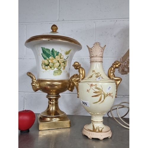 905 - Pair of decorative ceramic vases with gold accents. One vase features a grapevine design, the other ... 