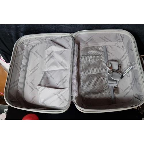 909 - United Colors of Benetton orange hard-shell suitcase with grey interior, featuring organized compart... 