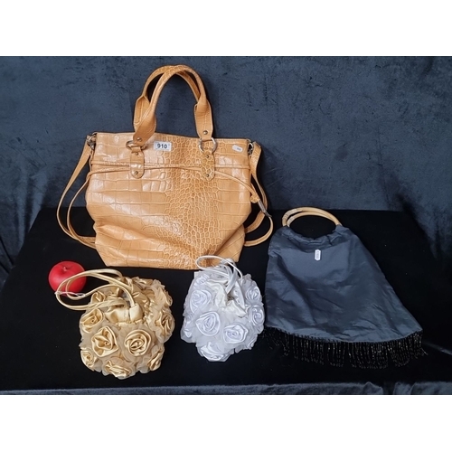 910 - Collection of four unique handbags. Includes a Ted Lapidus Paris faux croc-embossed tote and three d... 