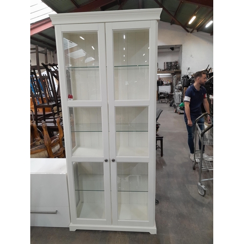 939 - A tall six shelved glass fronted display cabinet, From the Bedroom of the fabulous house in Fox Rock... 