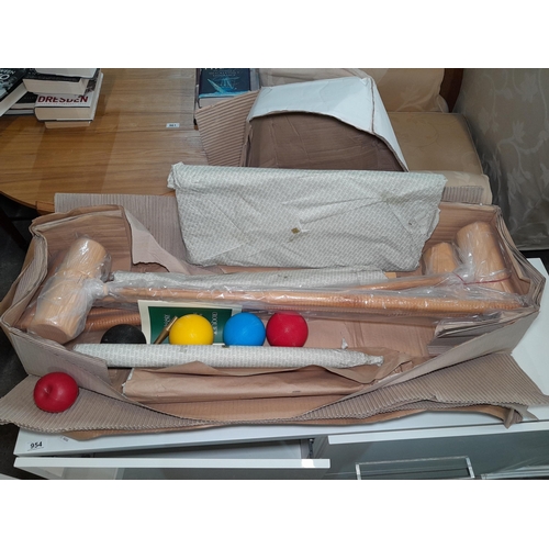 953 - An English made Jaques croquet set new in box with original wrappers. Contains instruction manual an... 