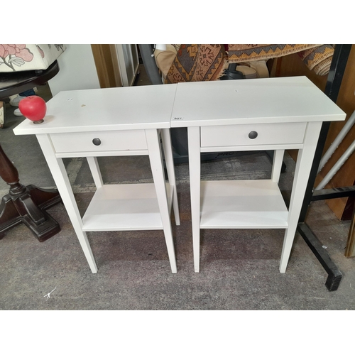 957 - A pair of sleek and stylish open facing nightstands with tapered legs, under storage and a pull out ... 