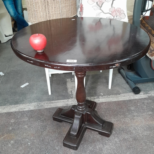 958 - A round cherrywood hall table on cross pedestal base