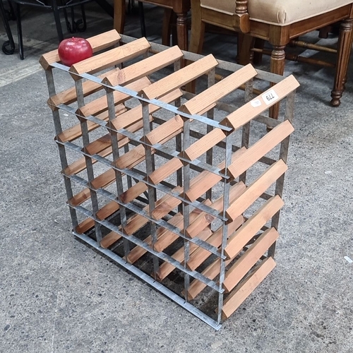 779 - Vintage wooden and metal wine rack, with a capacity for several bottles, featuring a grid design.