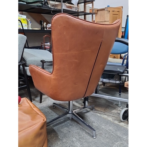 780 - Mid-Century Modern swivel chair with matching ottoman. Features a high back and tufted buttons on a ... 