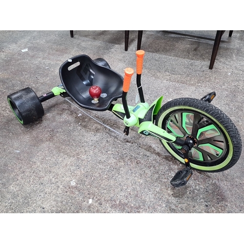 784 - Huffy Green Machine three-wheeled pedal-powered ride-on. Features lime green accents, dual handle co... 