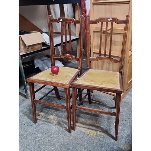 788 - Pair of vintage wooden chairs with ladder-back design and upholstered seats.