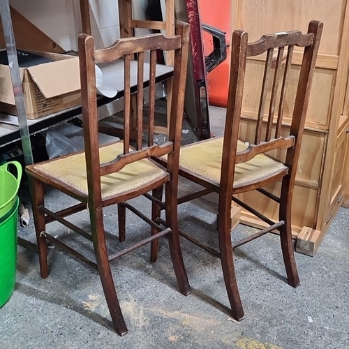 788 - Pair of vintage wooden chairs with ladder-back design and upholstered seats.