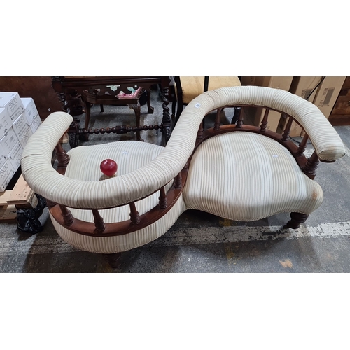 792 - Star lot :A fabulous  Victorian mahogany conversation sofa with striped upholstery. Features a serpe... 