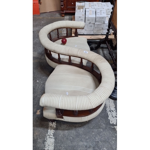 792 - Star lot :A fabulous  Victorian mahogany conversation sofa with striped upholstery. Features a serpe... 