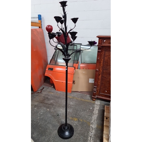 794 - Wrought iron floor-standing candelabrum with floral motif detailing. Black finish. Approximately 5 f... 