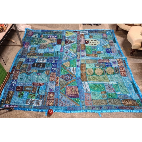 796 - Handcrafted patchwork quilt with vibrant blue and turquoise panels. Detailed with intricate embroide... 